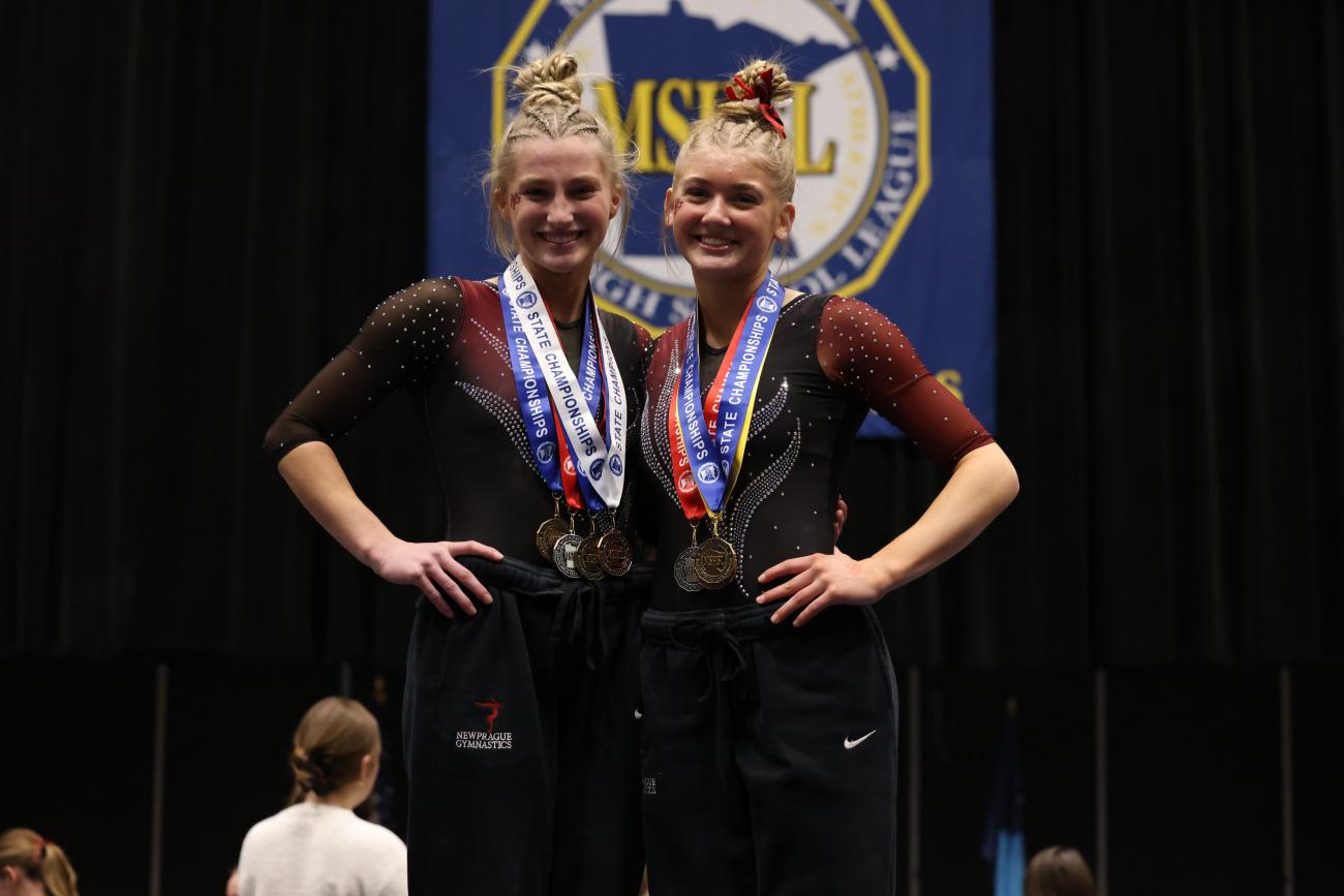 New Prague's Ava Bruegger and Hailey Proshak, the 2025 Class AA Girls Gymnastics all-around gold and silver medalists.