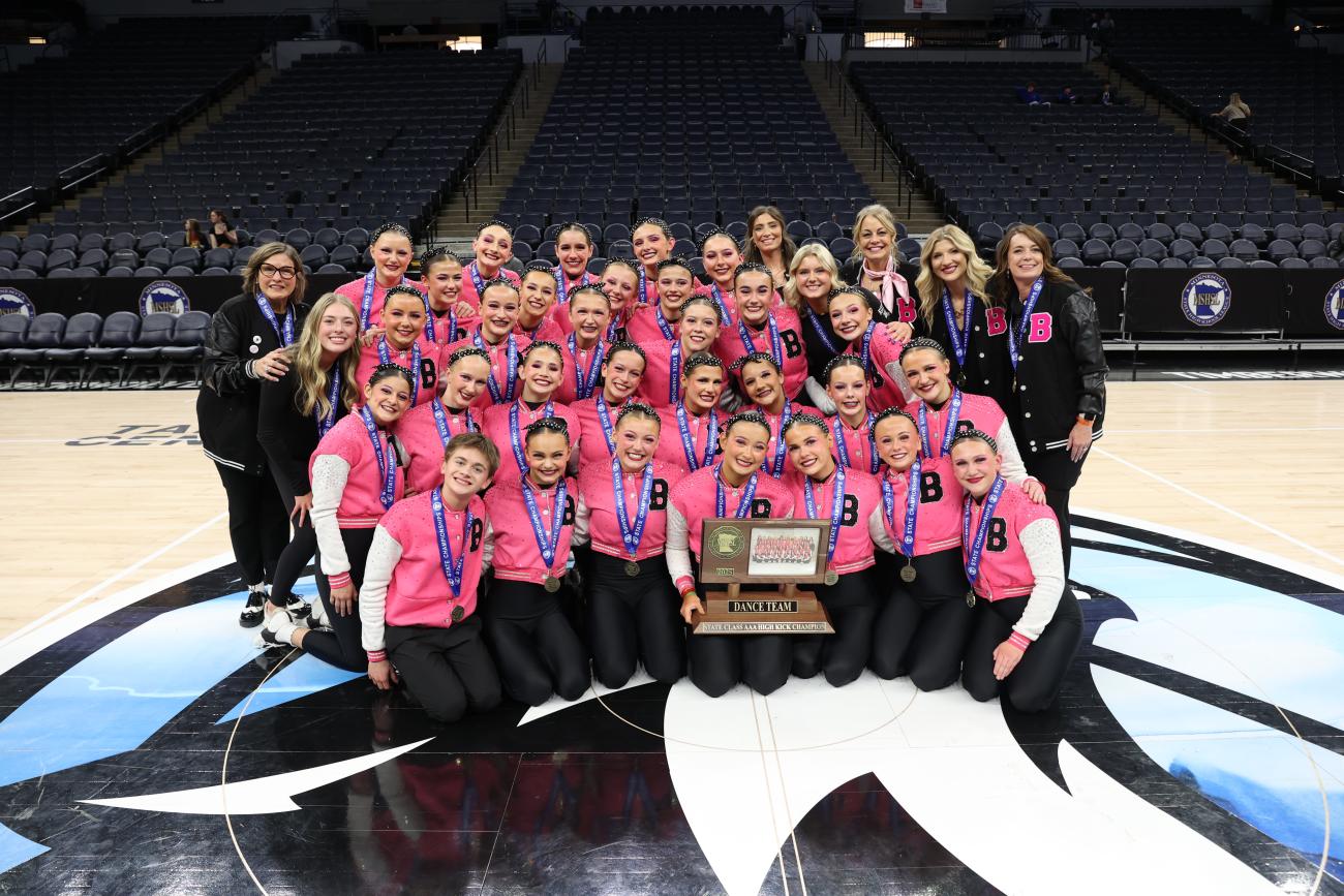 The Brainerd Dance Team poses with its 2025 Class AAA High Kick State Championship trophy.