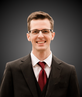 A headshot photo of administrative assistant Nathan Ford 